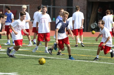 Freshman cheer each other on during a friendly soccer match during 3-C Field Events.