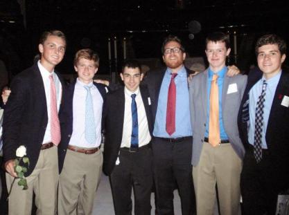 (l.-r.) Paul Gomez ’16, Clark Newby ’17, Mr. Joseph Amorizzo ’07, Mr. Matthew Chicavich ‘98, Sean Maleady ’17, and Matt Meade ’17 pose for a photos near the altar at MSG. 