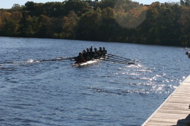 Chaminade’s varsity eight boat heads out of the dock to test the waters of the Charles River.