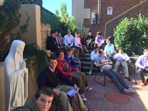 Homeroom 2L gathers in the courtyard of Saragossa to listen to a lecture by Mr. Matthew Chicavich ’98.
