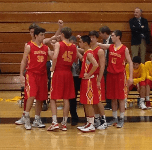 Chaminade’s Varsity Basketball athletes break their huddle after a discussion with their coach, Mr. Daniel Feeney.