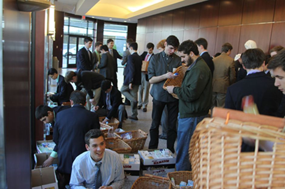 Members of Emmaus and the Junior GSO organize the toiletries in the Pieta Lobby of the Activity-Athletic Center. 