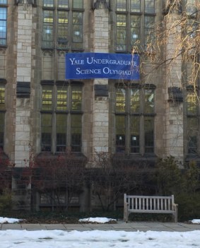 A banner posted on one of the ivy covered walls of Yale welcomes to the Science Olympiad competitors. 