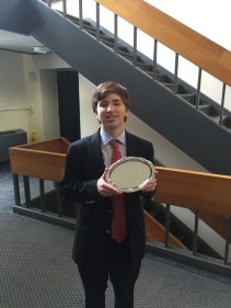 Aidan Fitzgerald ’18 displays the platter he received as a reward for being the 5th best speaker in JV Lincoln-Douglas for the Harvard Invitational Tournament.