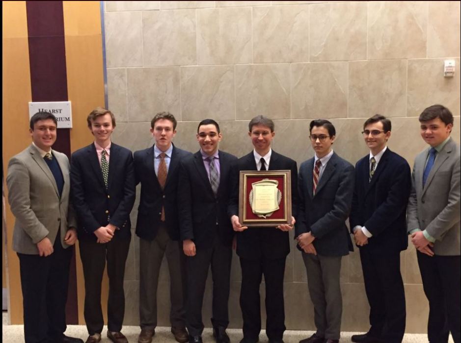 Senior members of the Crimson and Gold editorial staff, (l.-r.) Robert Paradiso, Andrew Hertlein, Owen Corrigan, Michael Navarrete, Andrew Garcia, Eli Jaghab, and Brandon Teixeira, stand with Bro. Benjamin Knapp S.M. ’93 after awarding him with the yearbook dedication.