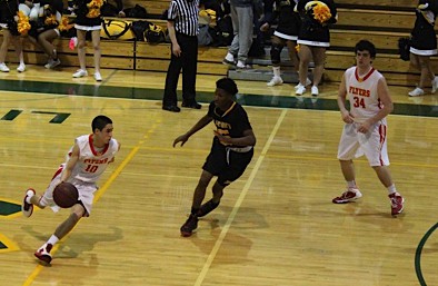 Ryan Dean ’16 drives to the hoop trying to establish an offensive lead for Chaminade.