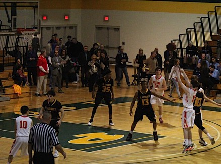 Michael McGuire ’16 goes for the three in an attempt to stifle St. Anthony’s growing offensive lead.