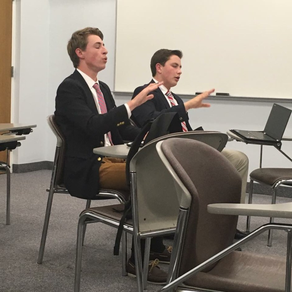 Varsity Public Forum team Rob Wines ’16 and Brendan Owens ’16 defend themselves during crossfire. 