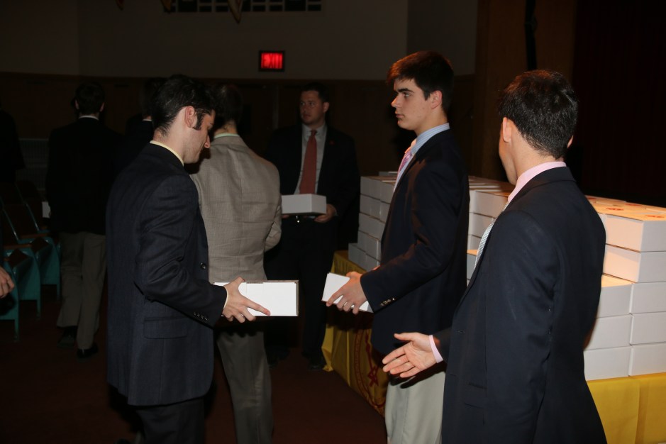 Members of C.R.O.S.S. hand out “Spiritual Survival Kits” to the senior class.