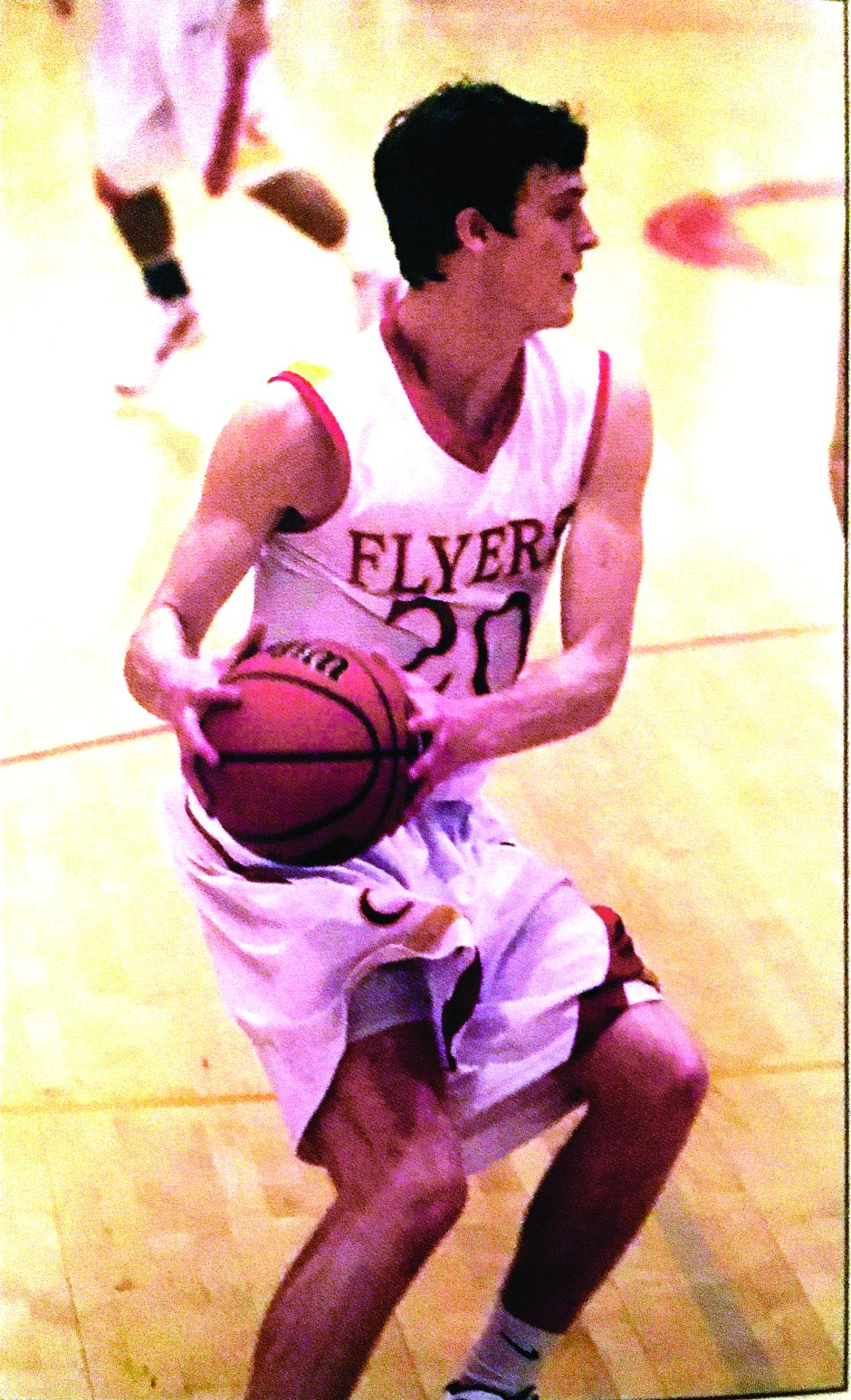 Patrick Farrell ’12 resists aggressive defense while trying to score for the Flyers.