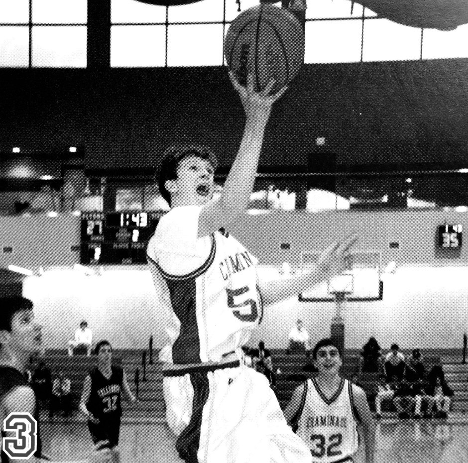 During his freshman year, Farrell converts a layup after snatching an offensive rebound.