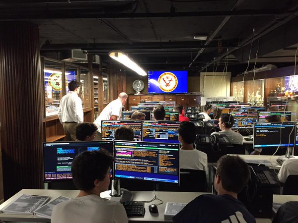 Tim Burger ’15 and Mr. Scott Cole ’95 share their knowledge of finance with the eager campers. 