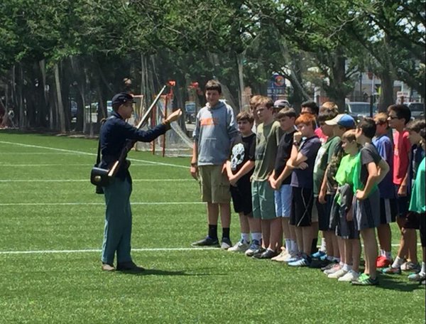 A Civil War reenactor offers the campers insight on the battles of the war and the weapons used by soldiers.