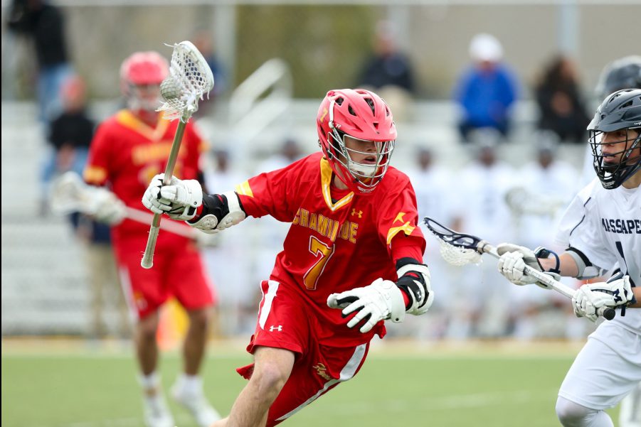 Joe Carney ’16 skillfully evades Massapequa’s defense.