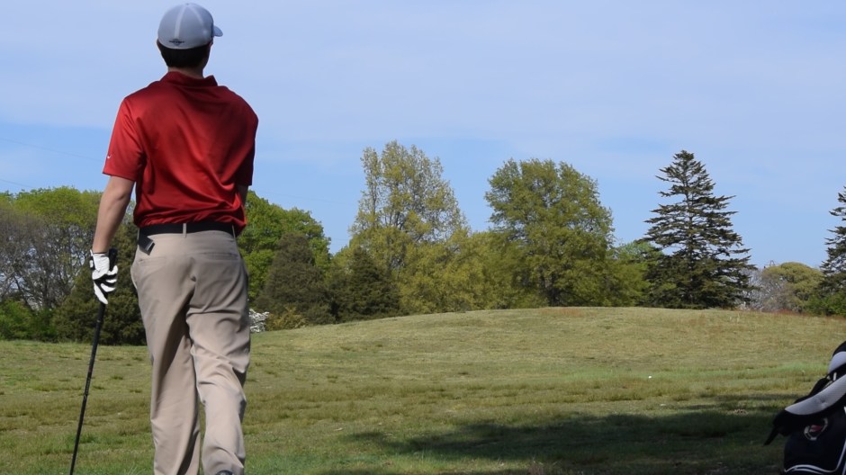 Dulaney Glen ’18 watches as his perfectly aimed shot descends through the air and onto the course.