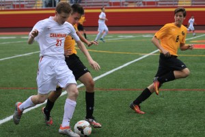 Michael Lynch ‘20 protects the ball from an attacking Friar.