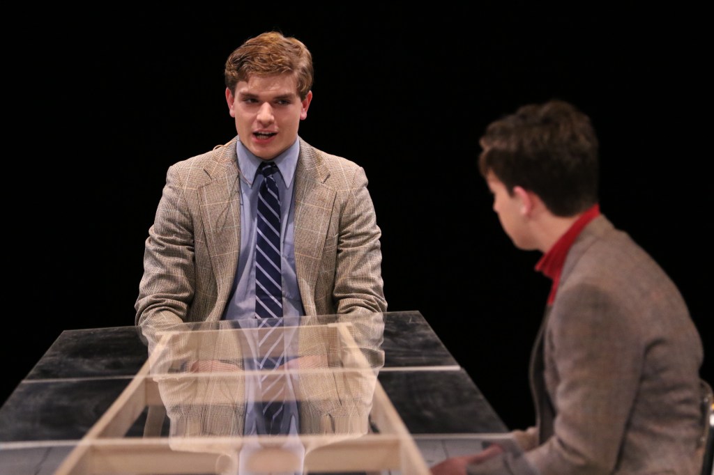 Patrick Johnson ’17 and Chris Devlin ’19 (l.-r.) talk with one another at the dining room table.
