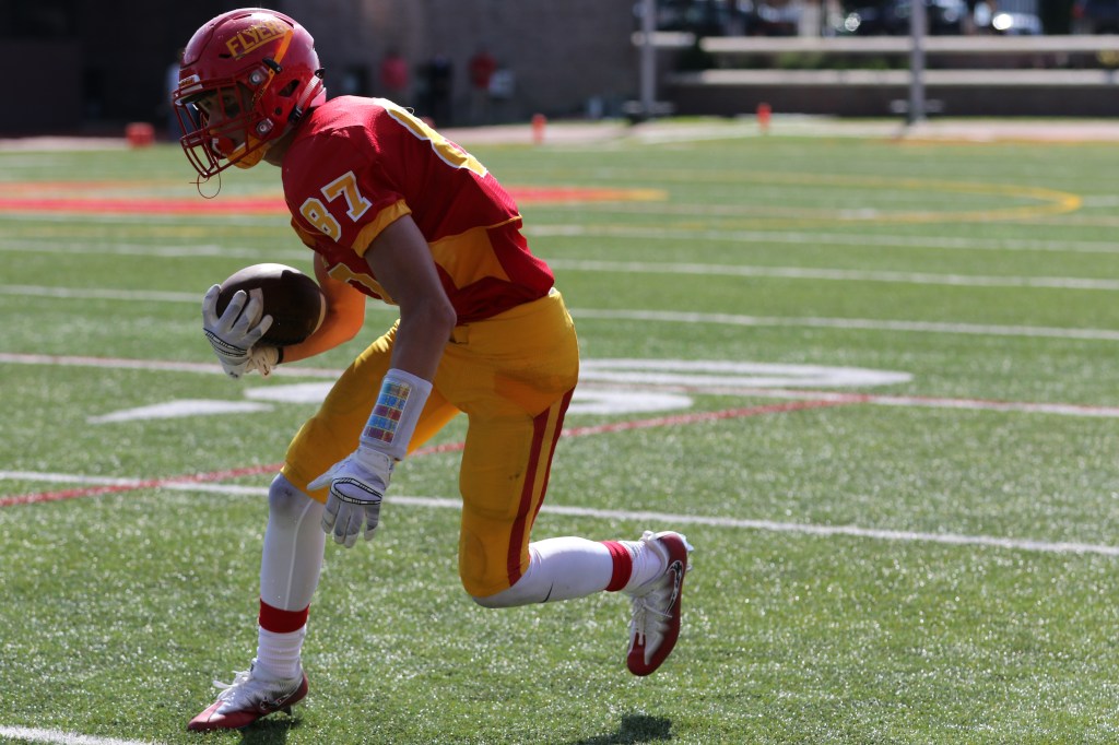 A core senior member of the Flyer offense, wideout Dominic Doria cuts in while scanning the field.