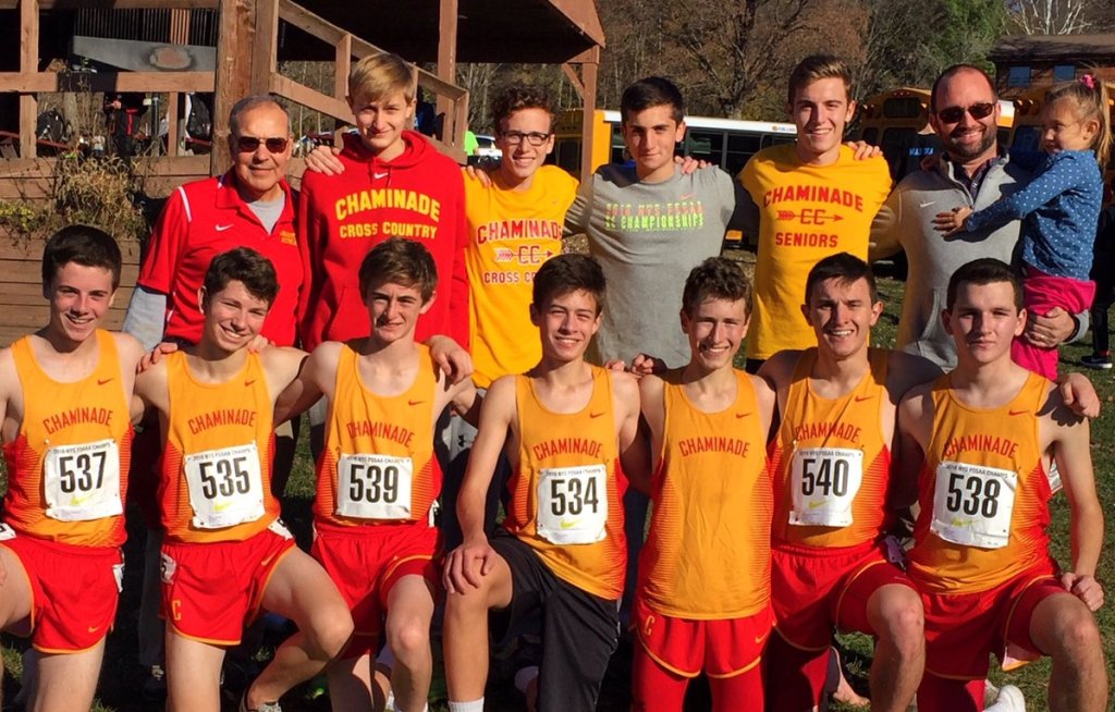 With coaches Carriero (back l.) and Beirne (back r.), the cross country team poses for an end-of-season photo.