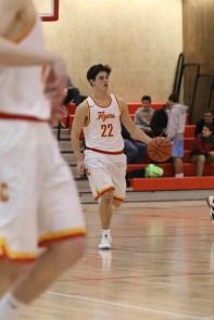 Point Guard Regan Quinn ’17 scans the court for an open man.