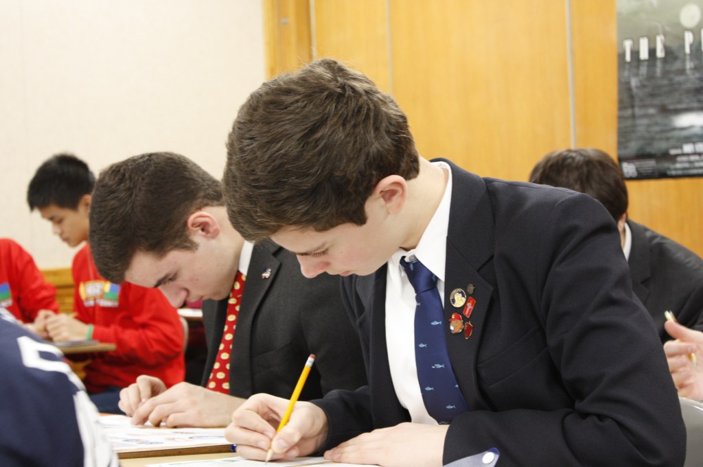 Dylan Richardson ’19 (near) and Chris Mercadante ’18 (far) are hard at work on their Dynamic Planet test.