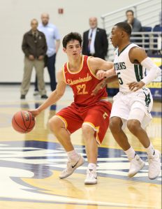 Point guard Regan Quinn ’17 protects the ball as he shuffles past center court and searches for options in the Flyers’ offensive drive.