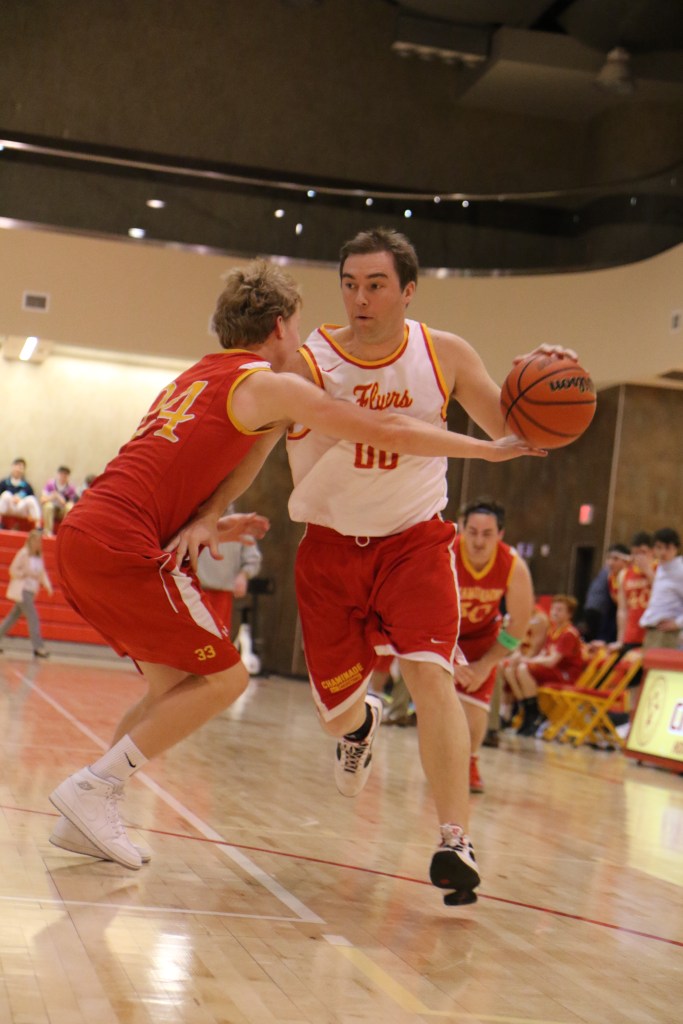 Mr. Daniel Feeney brushes passed one of his many competitors as he prepares for a layup.